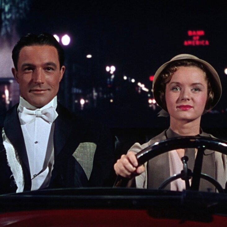 singin-in-the-rain-1952-003-gene-kelly-debbie-reynolds-driving-car_0